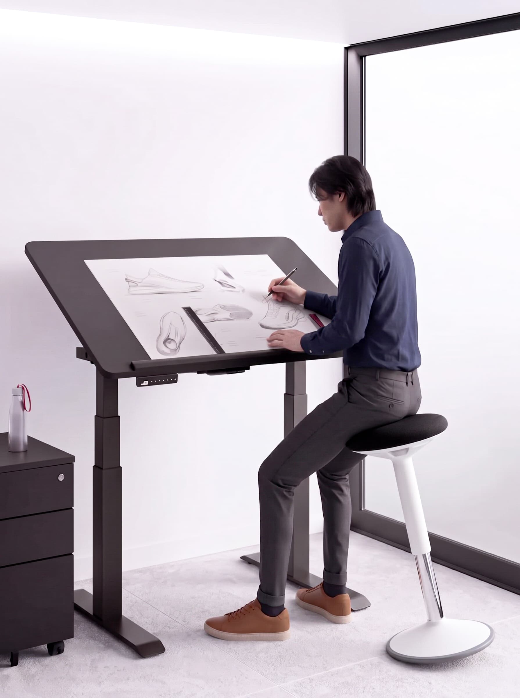 A desk surface rising while a person shifts from seated to standing